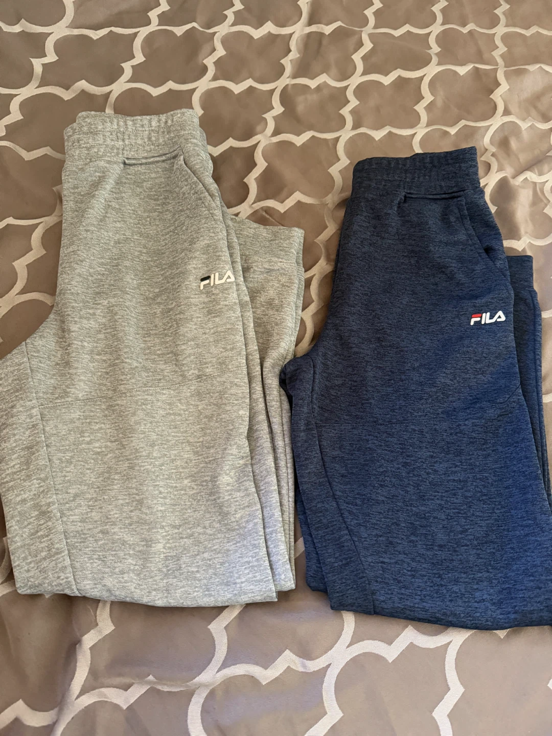 Two pairs of Fila youth joggers, size XL