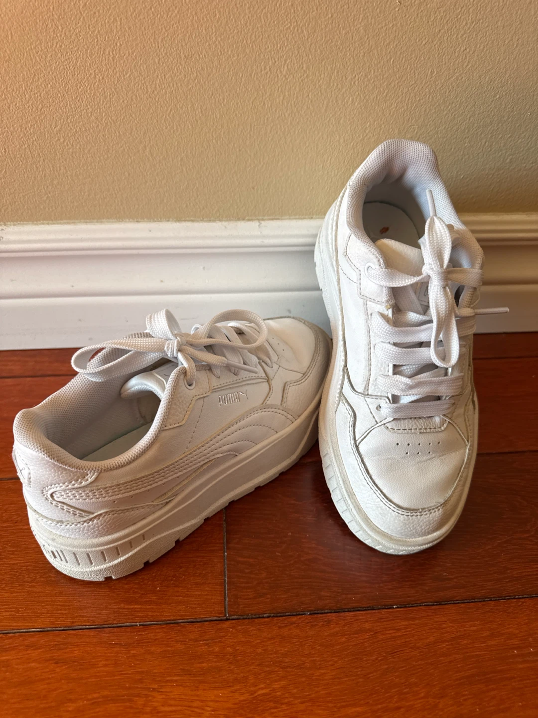 White PUMA running shoes