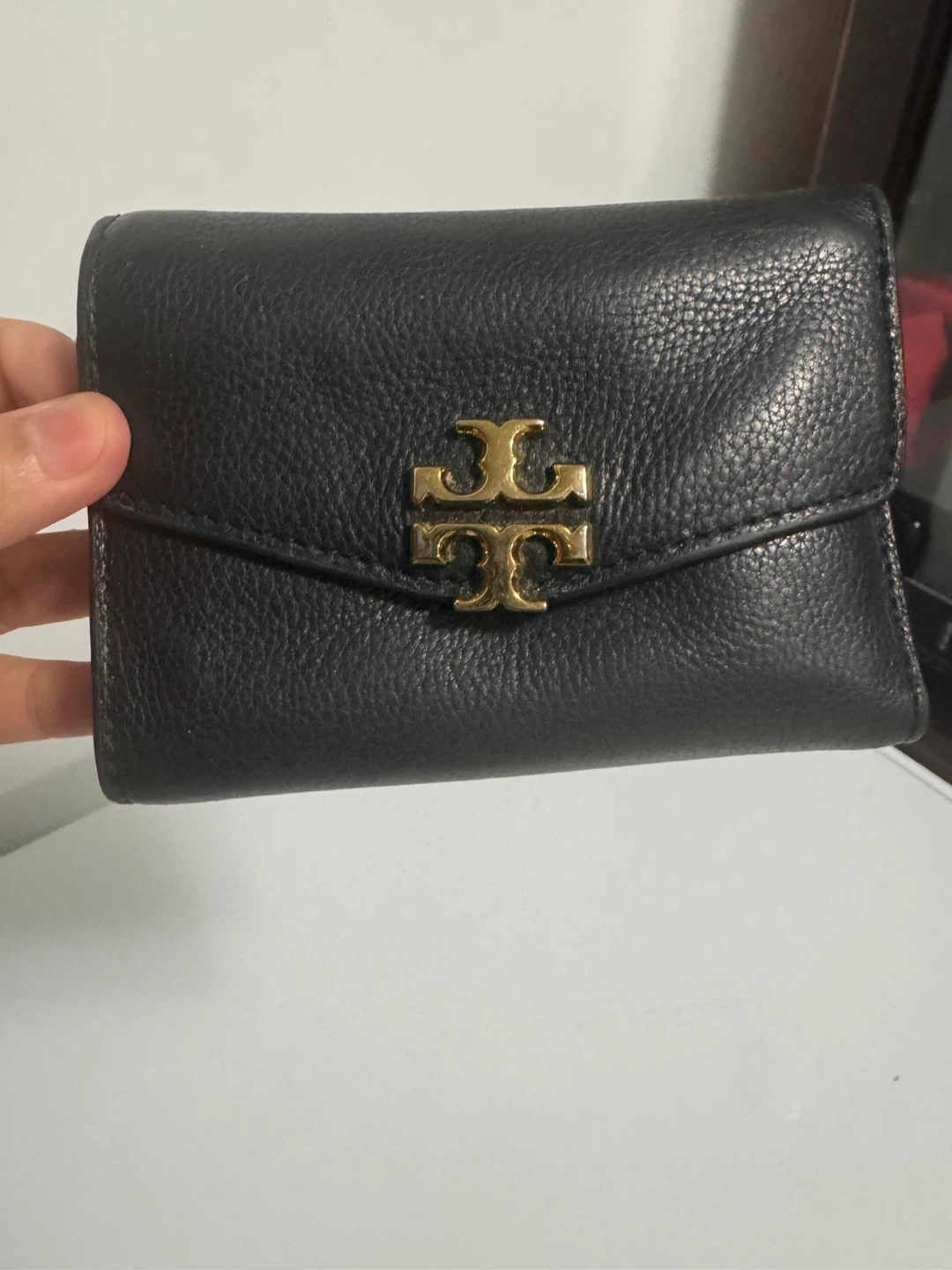 Tory Burch black leather tri-fold wallet
