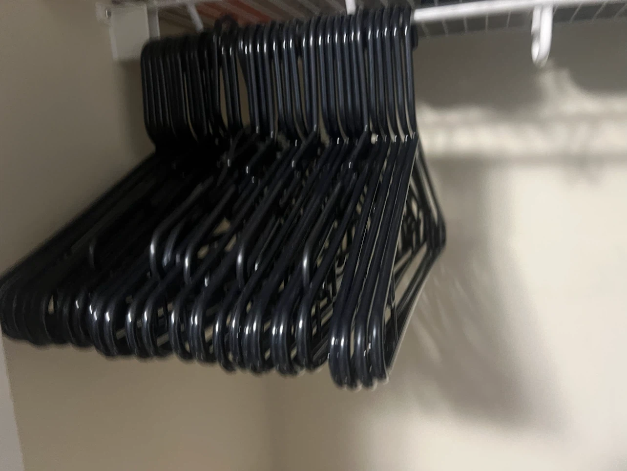 Set of black plastic clothes hangers