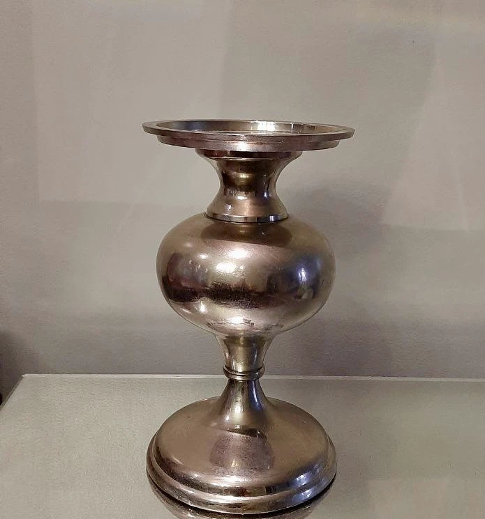Silver-toned pedestal candle holder with glass vase