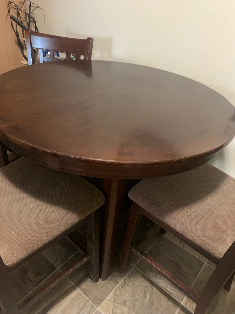 Round wooden dining table and chairs set