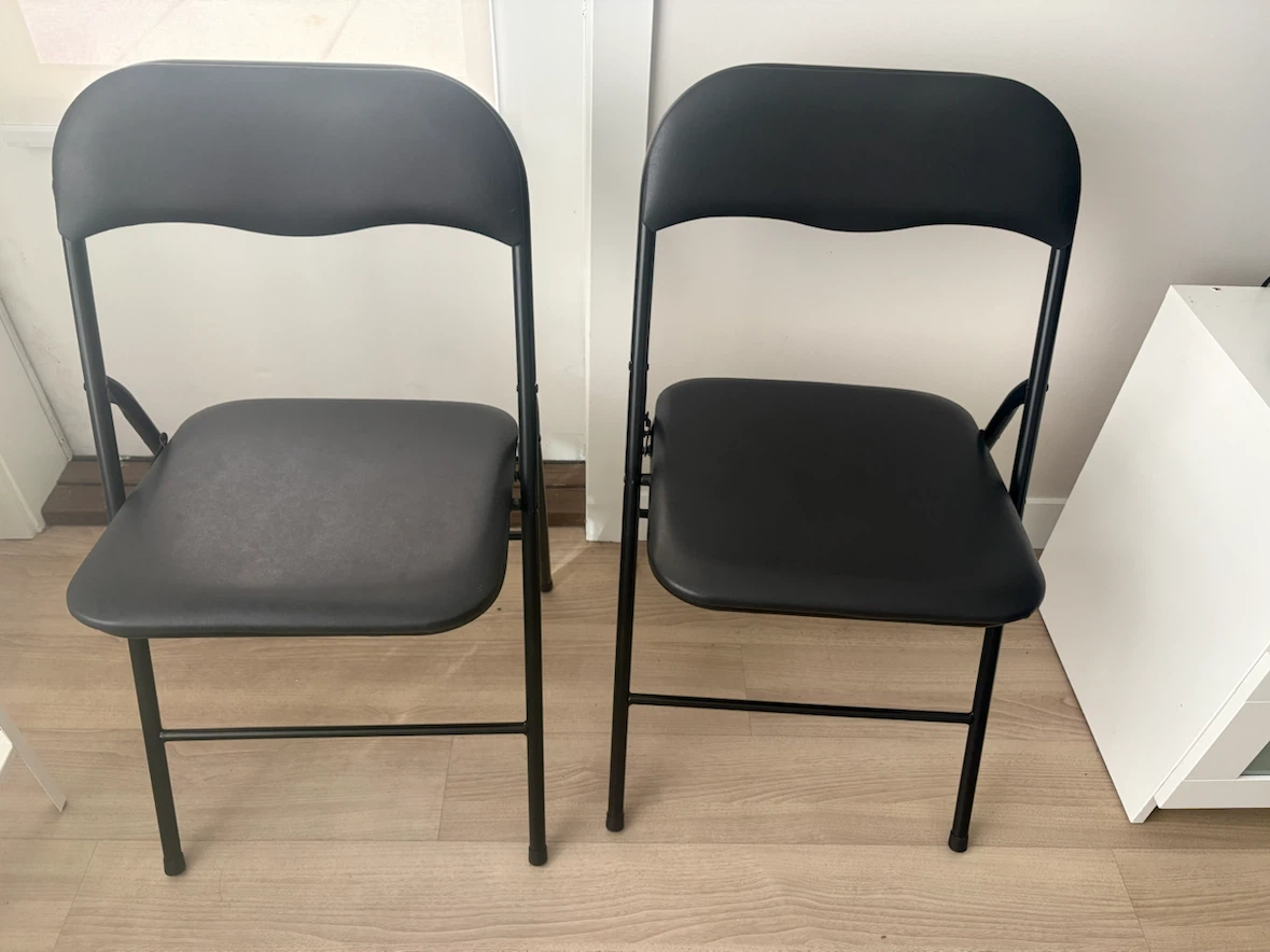 Two Black Folding Chairs