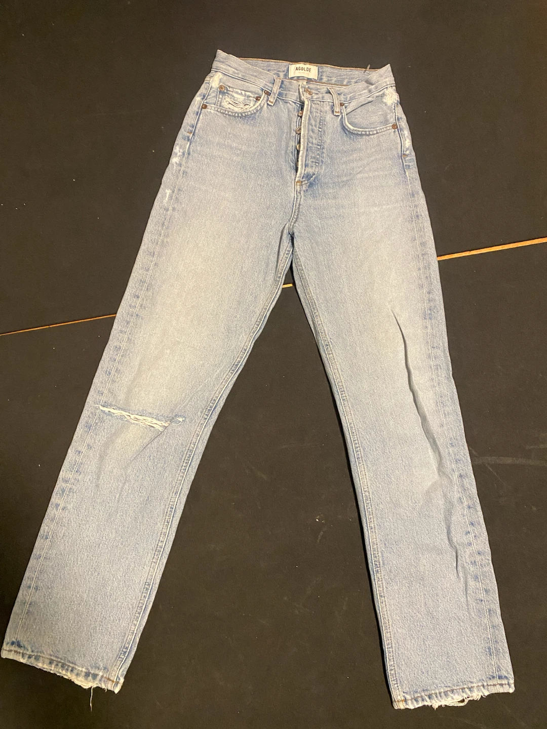 AGOLDE light wash distressed denim jeans