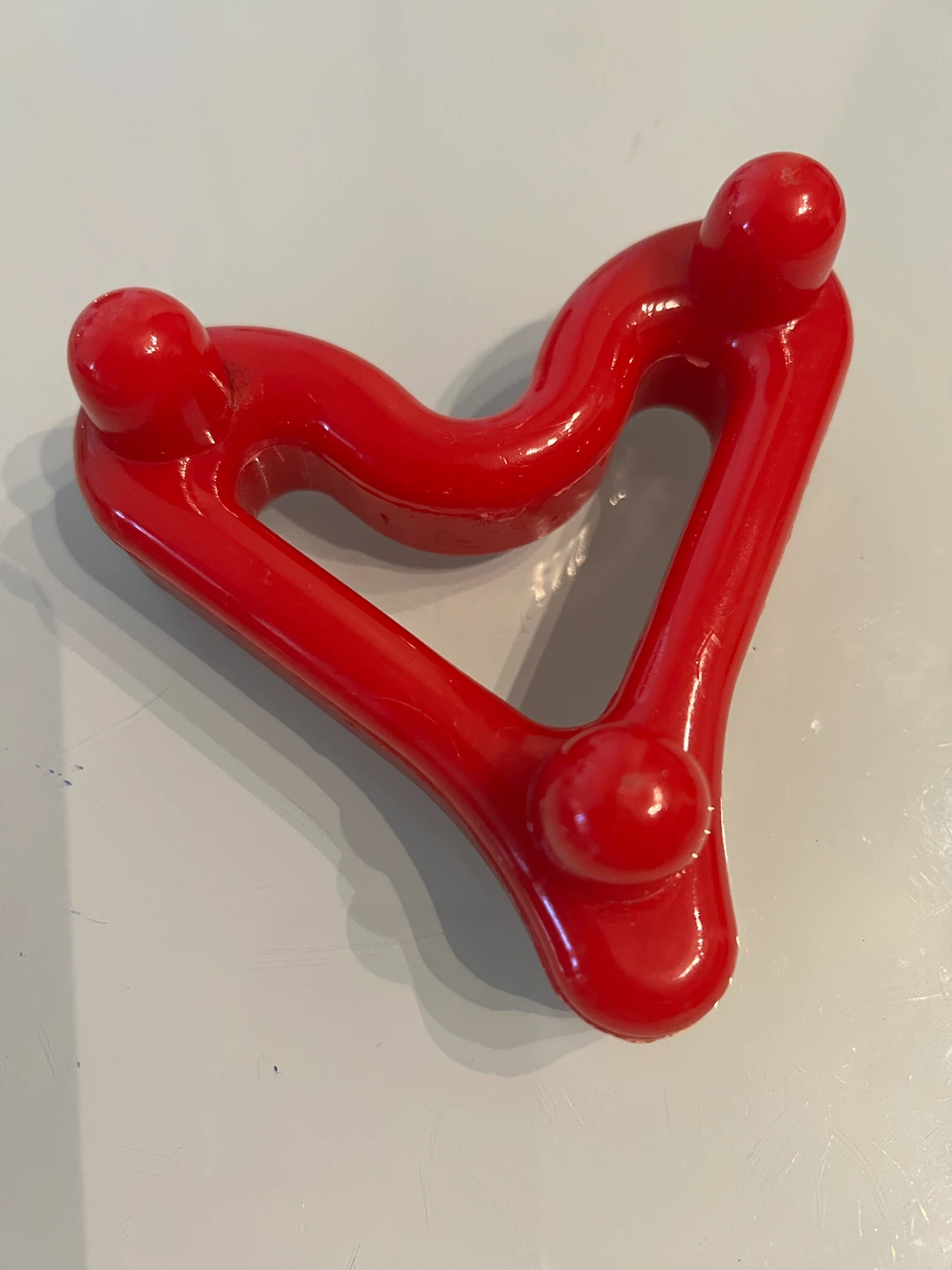 Red heart-shaped massage tool