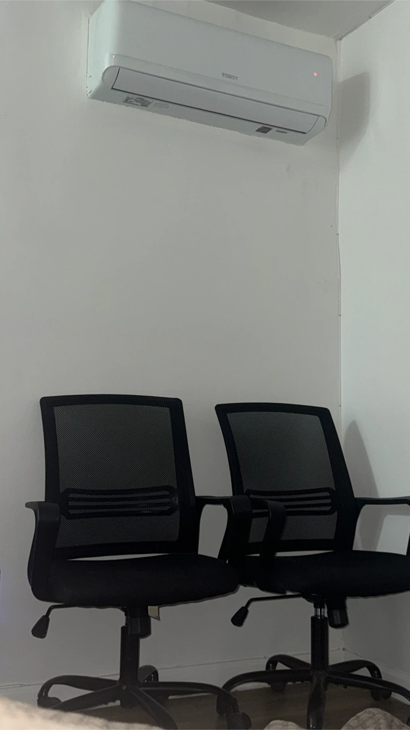 Two Black Mesh Office Chairs