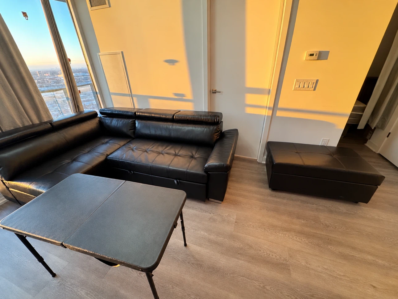 Black Leather Sectional Sofa with Storage Ottoman