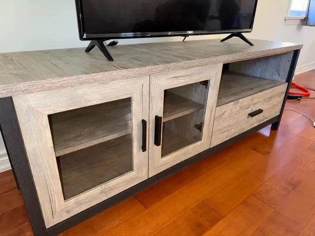 Rustic grey wood TV stand with glass doors
