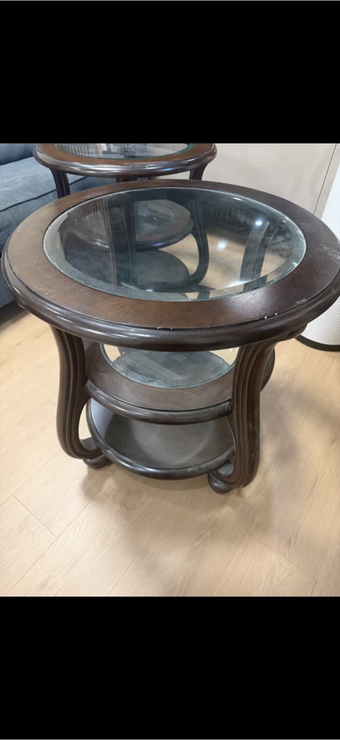 Set of two round dark wood side tables - photo 2