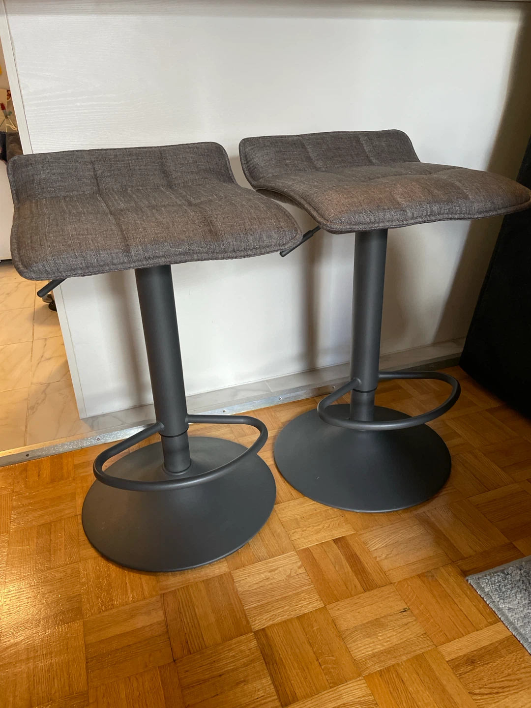 Set of two grey fabric bar stools