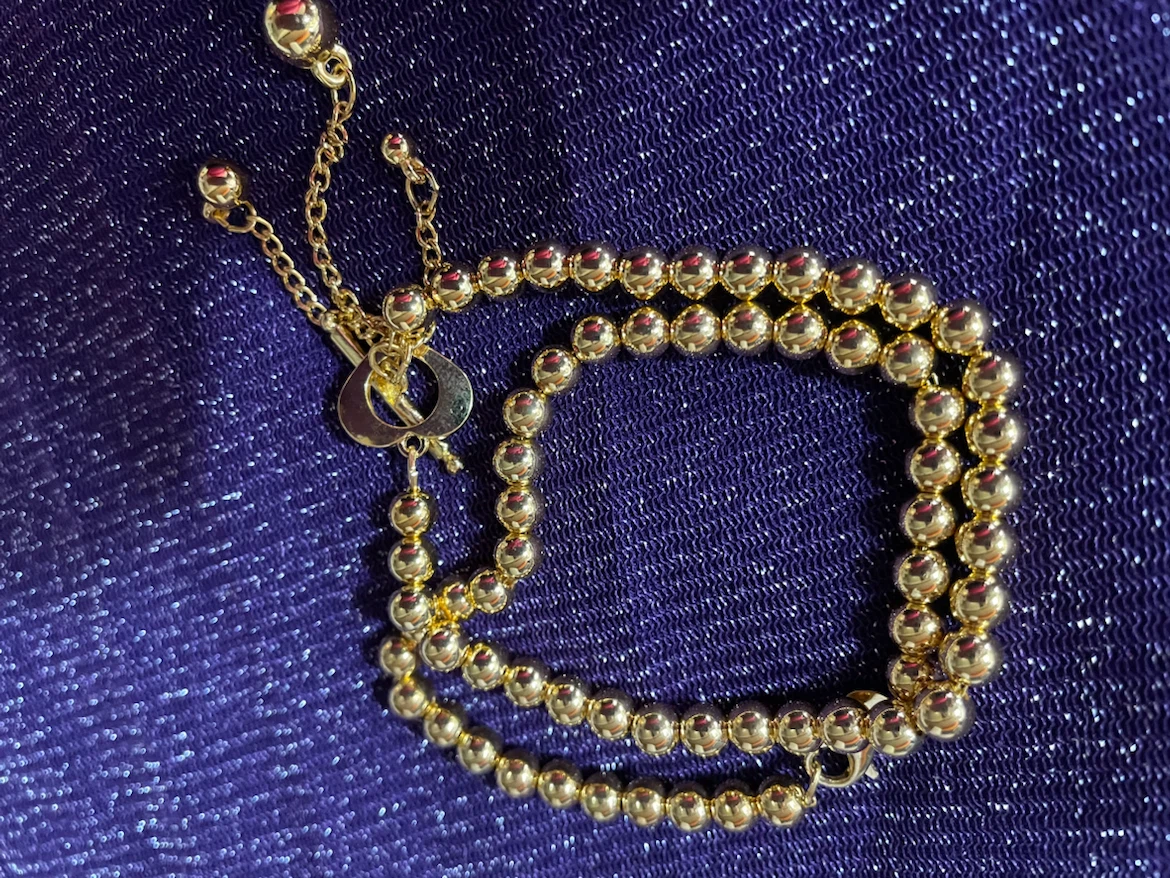 Two gold plated hand beaded bracelets