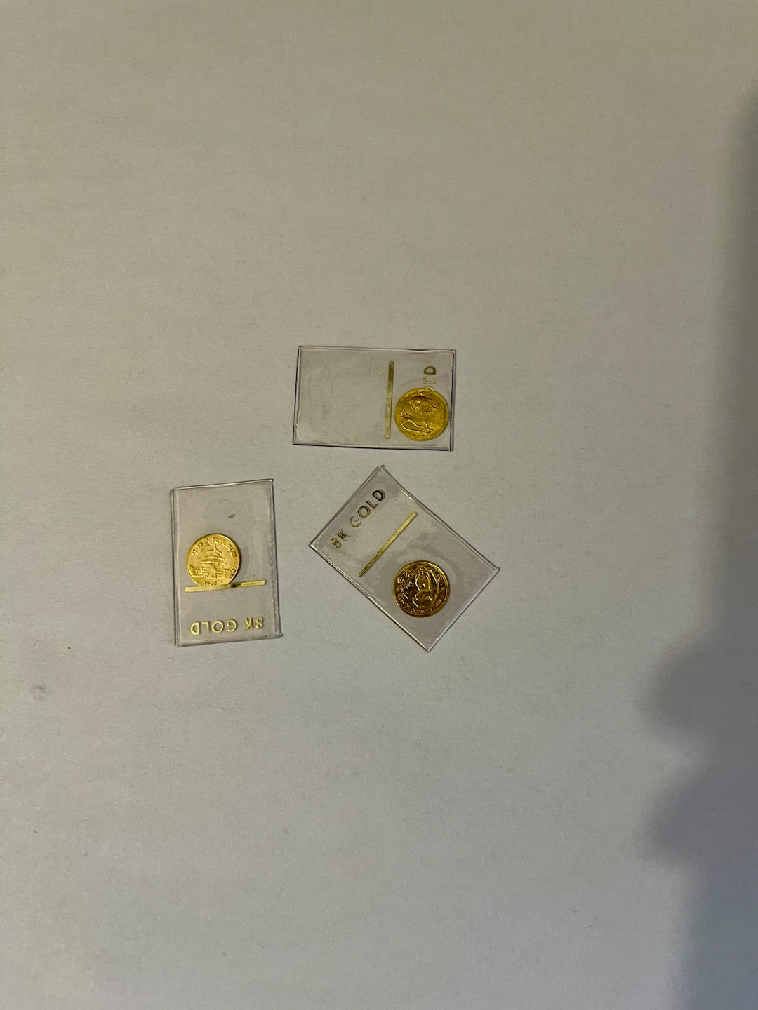 Three 8K Gold Panda Coins