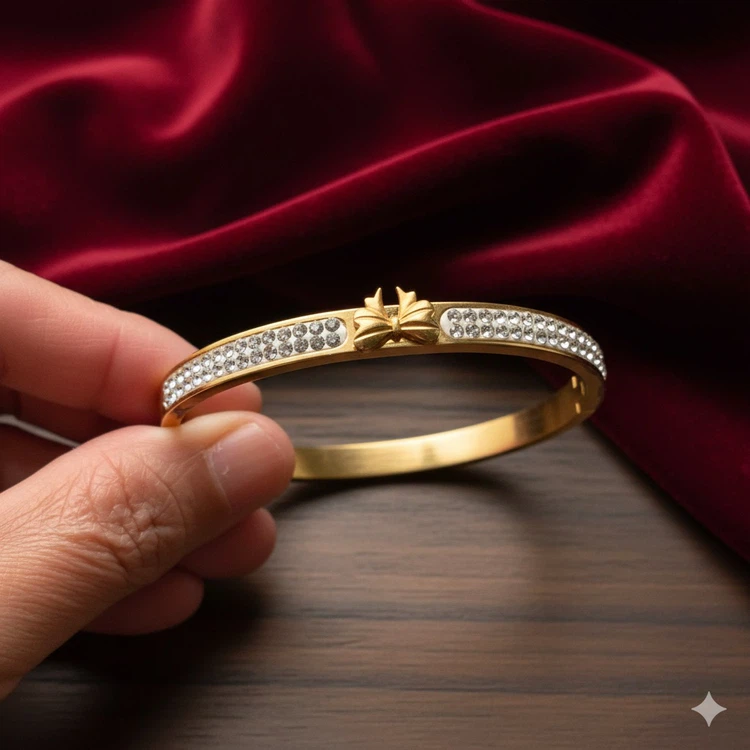 Gold-tone butterfly rhinestone bangle