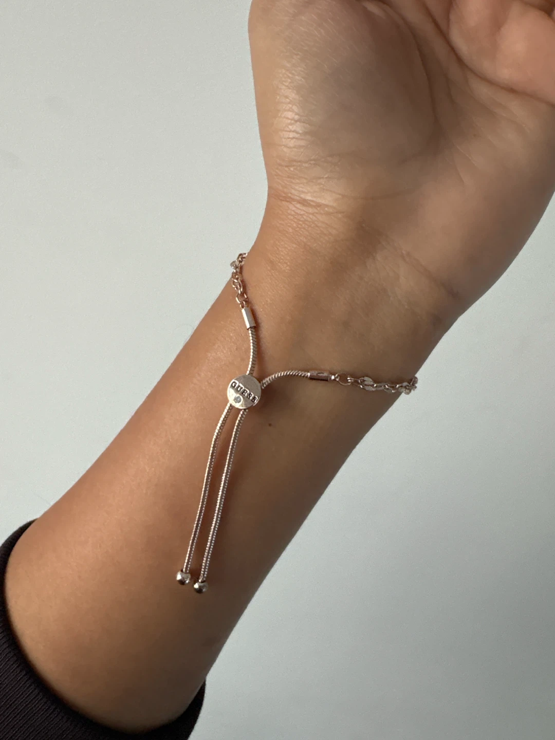 Guess adjustable rose gold-tone charm bracelet