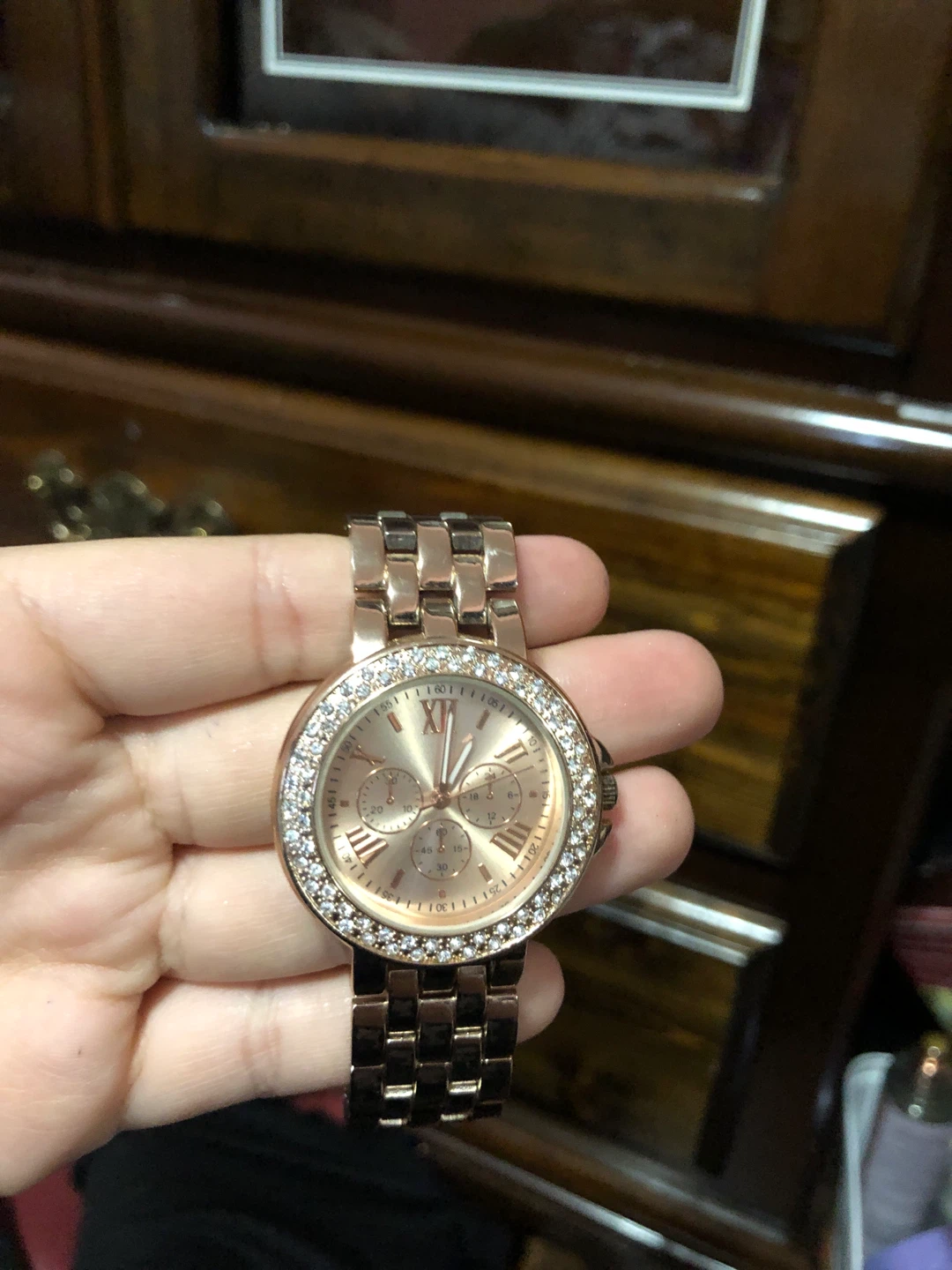 Rose gold tone chronograph watch with rhinestones