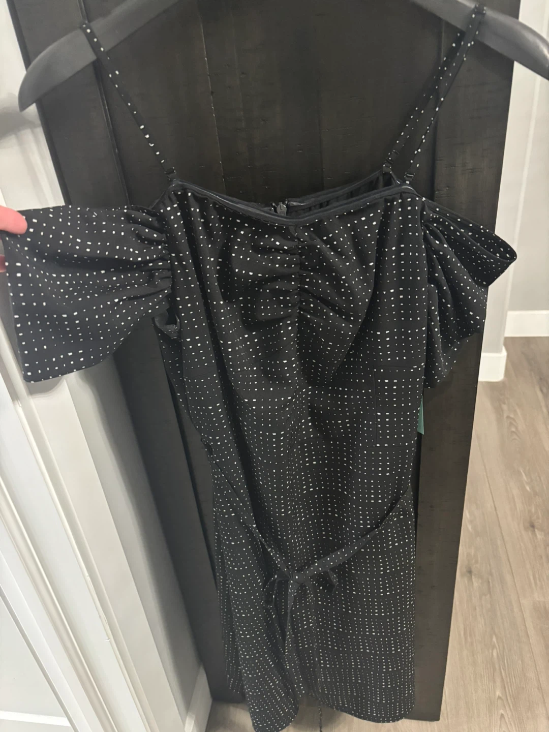 Black and white polka dot off-shoulder jumpsuit