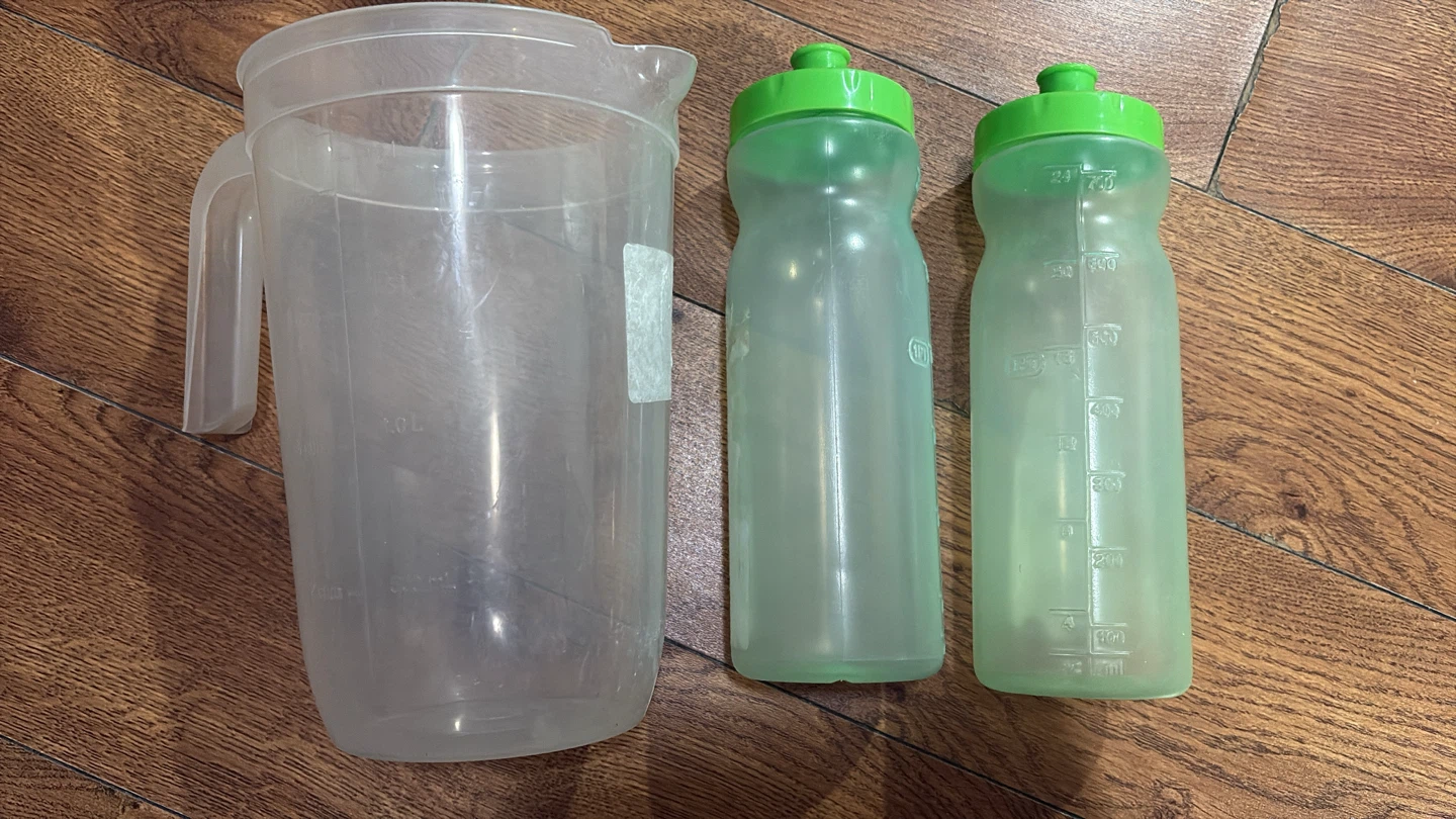 Plastic Pitcher and Two Water Bottles