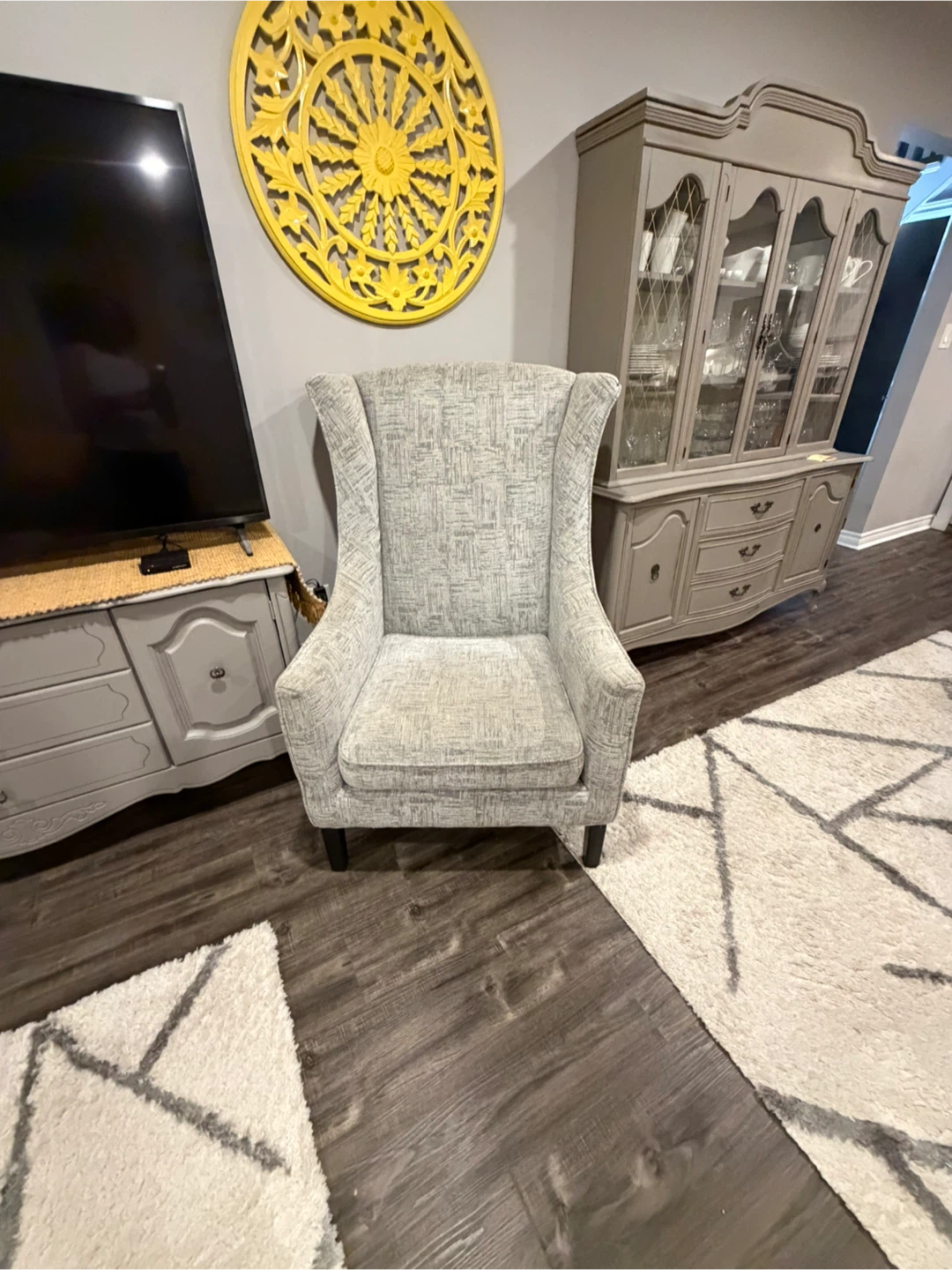 Grey patterned wingback chair