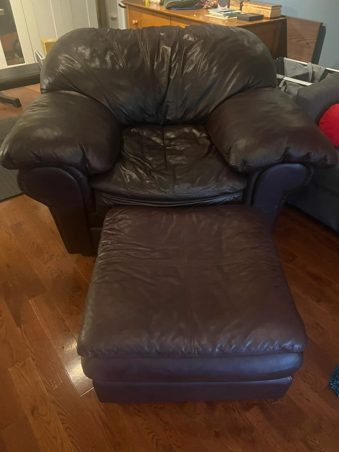 Dark Burgundy Leather Armchair and Ottoman