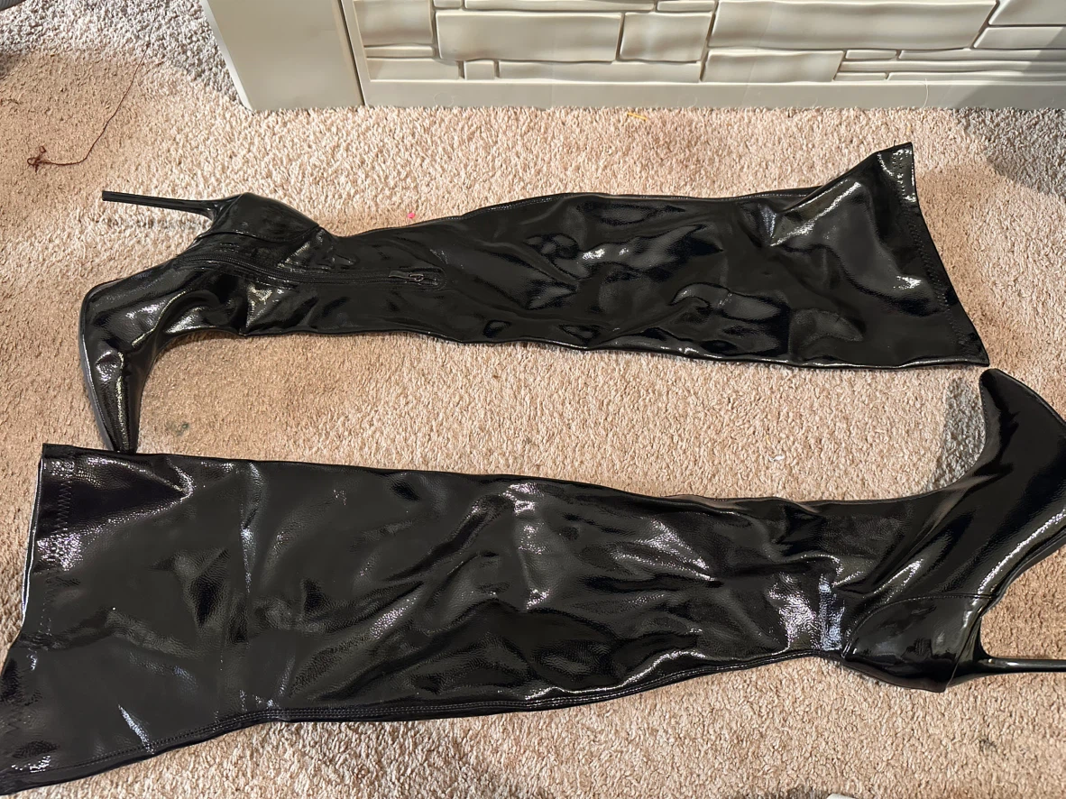 Black patent leather over-the-knee stiletto boots