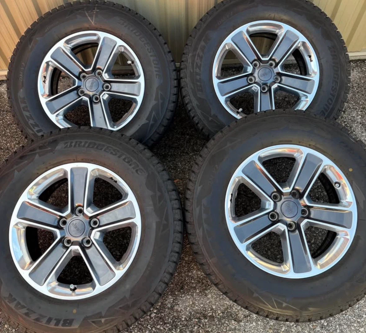 4 x 255/70/18 BRIDGESTONE WINTER TIRES AND JEEP RIMS $1550