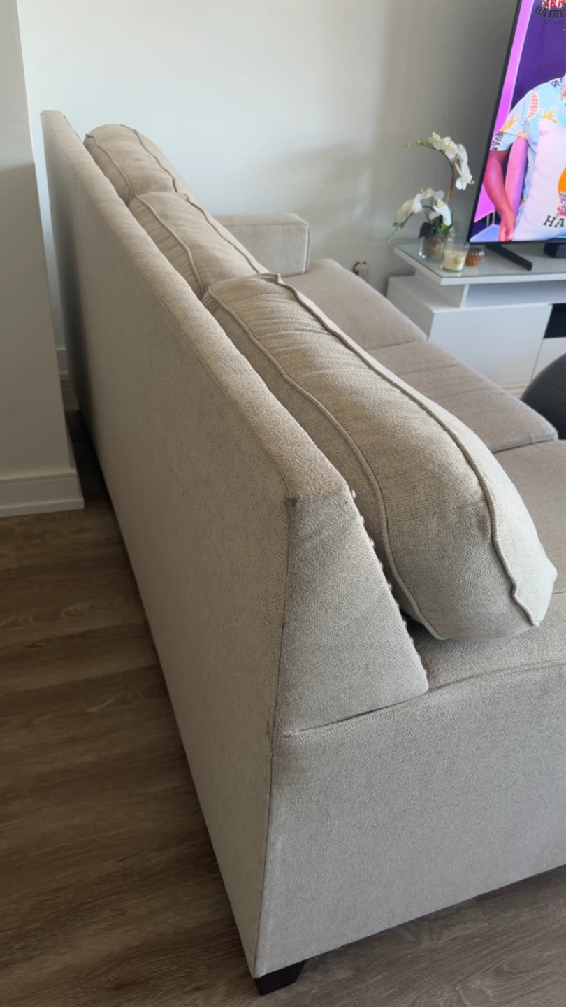 Beige Upholstered Sofa with Nailhead Trim