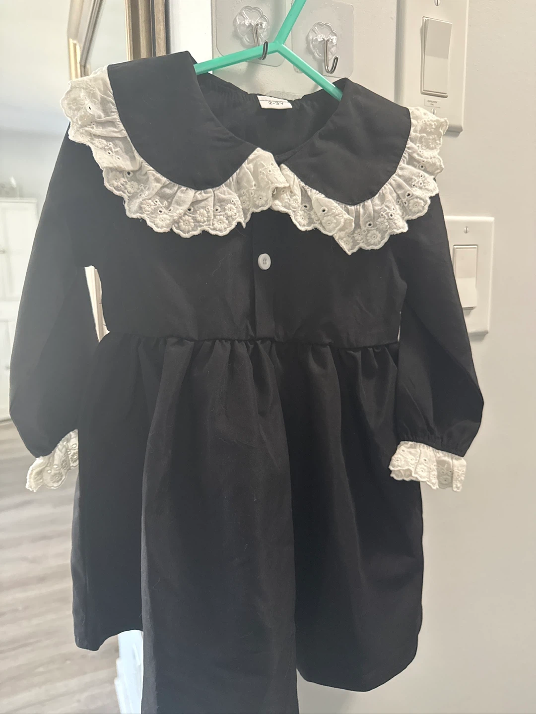 Black dress with white lace collar