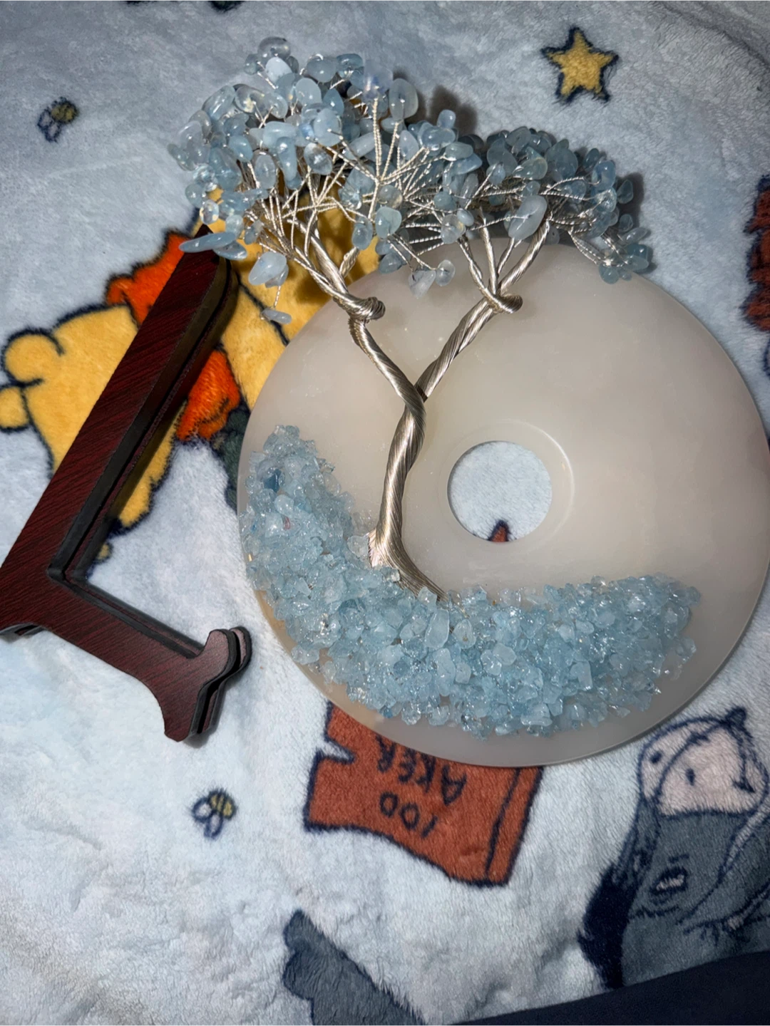 An aquamarine crystal wire-wrapped Tree of Life sculpture