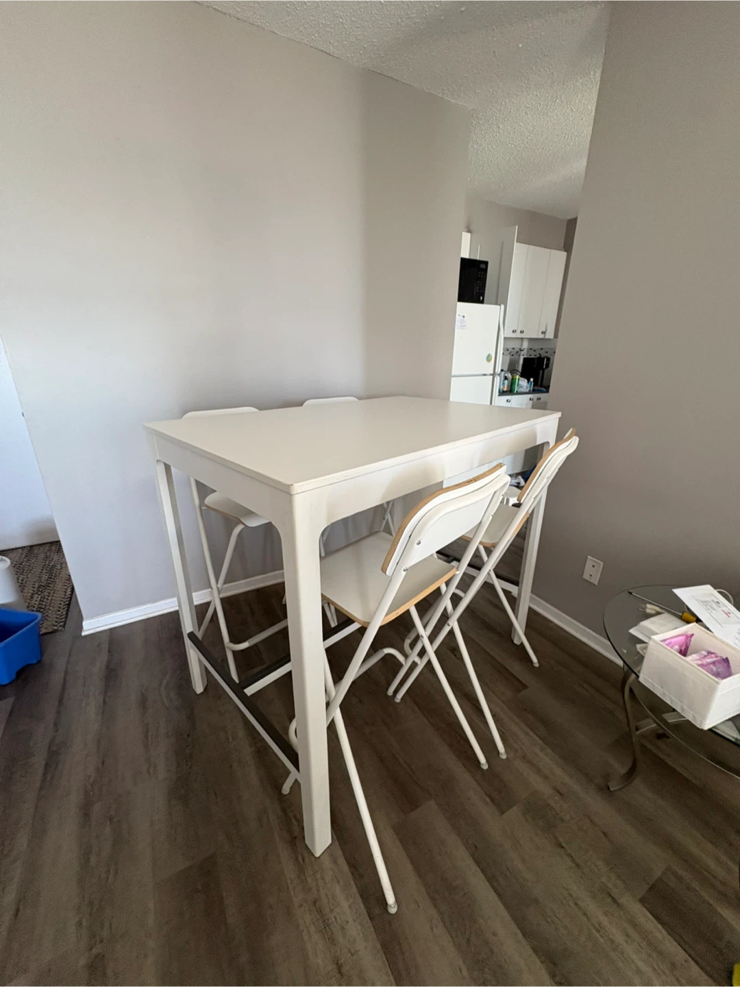 IKEA bar table and four folding chairs