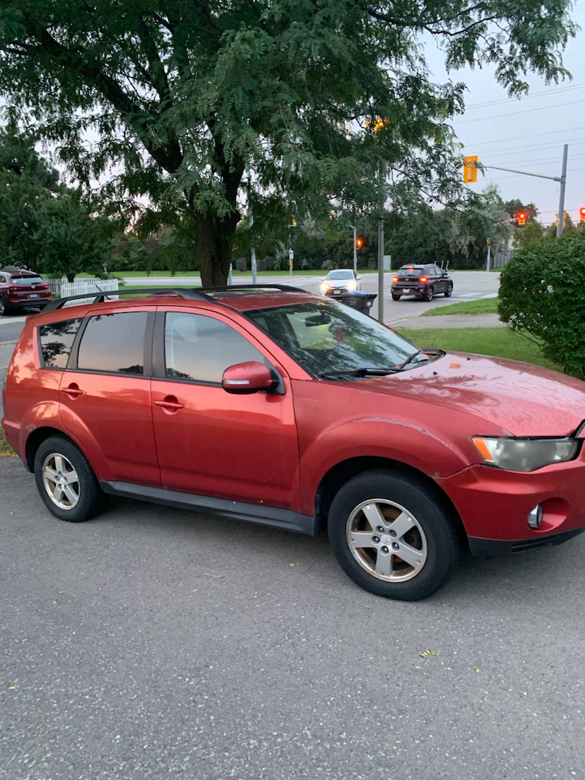Red Mitsubishi Outlander SUV