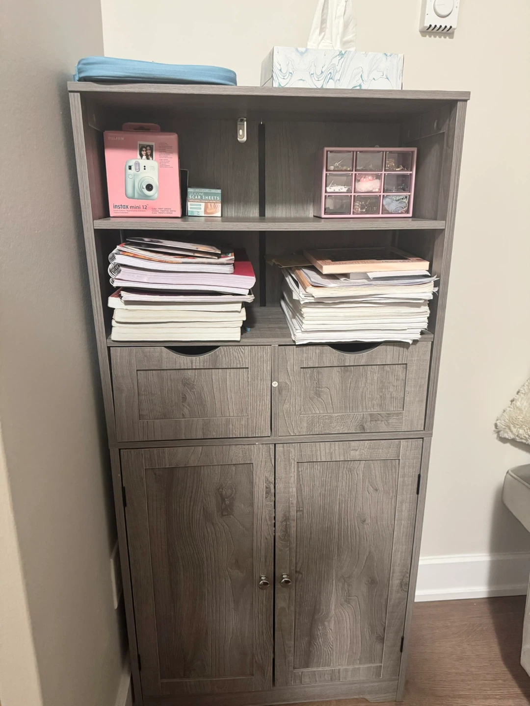 Grey storage cabinet with drawers