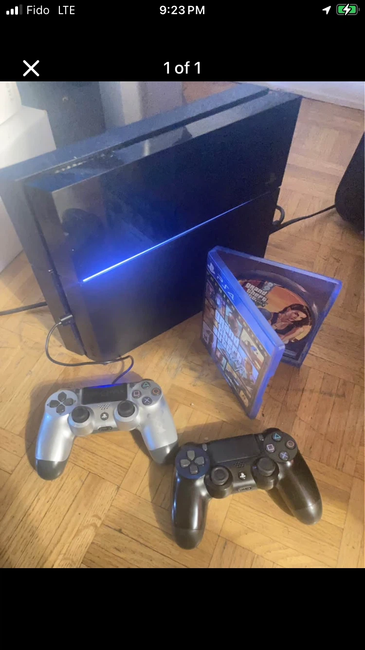 Sony PlayStation 4 Console with Two Controllers and Game