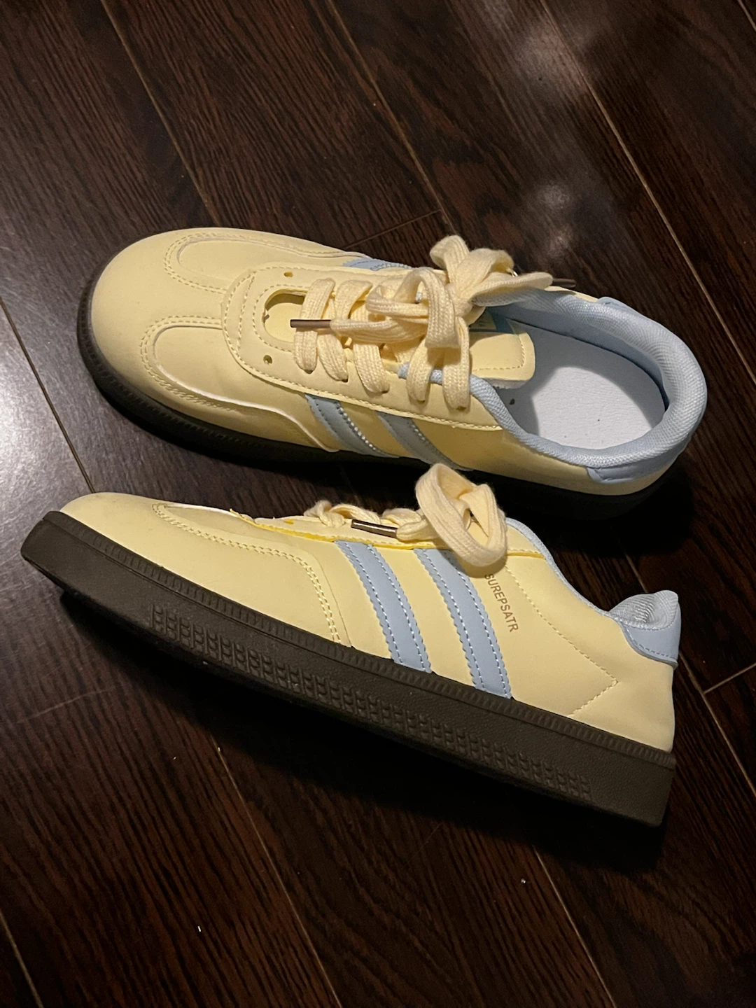 Baby yellow and baby blue sneakers