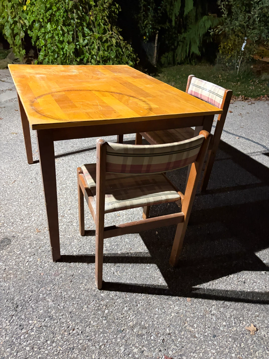 Wooden dining table with two chairs