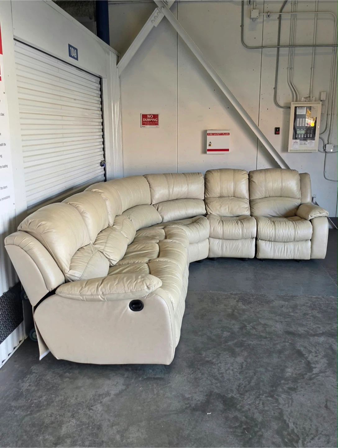 Spacious sectional sofa is upholstered in cream leather. - photo 2