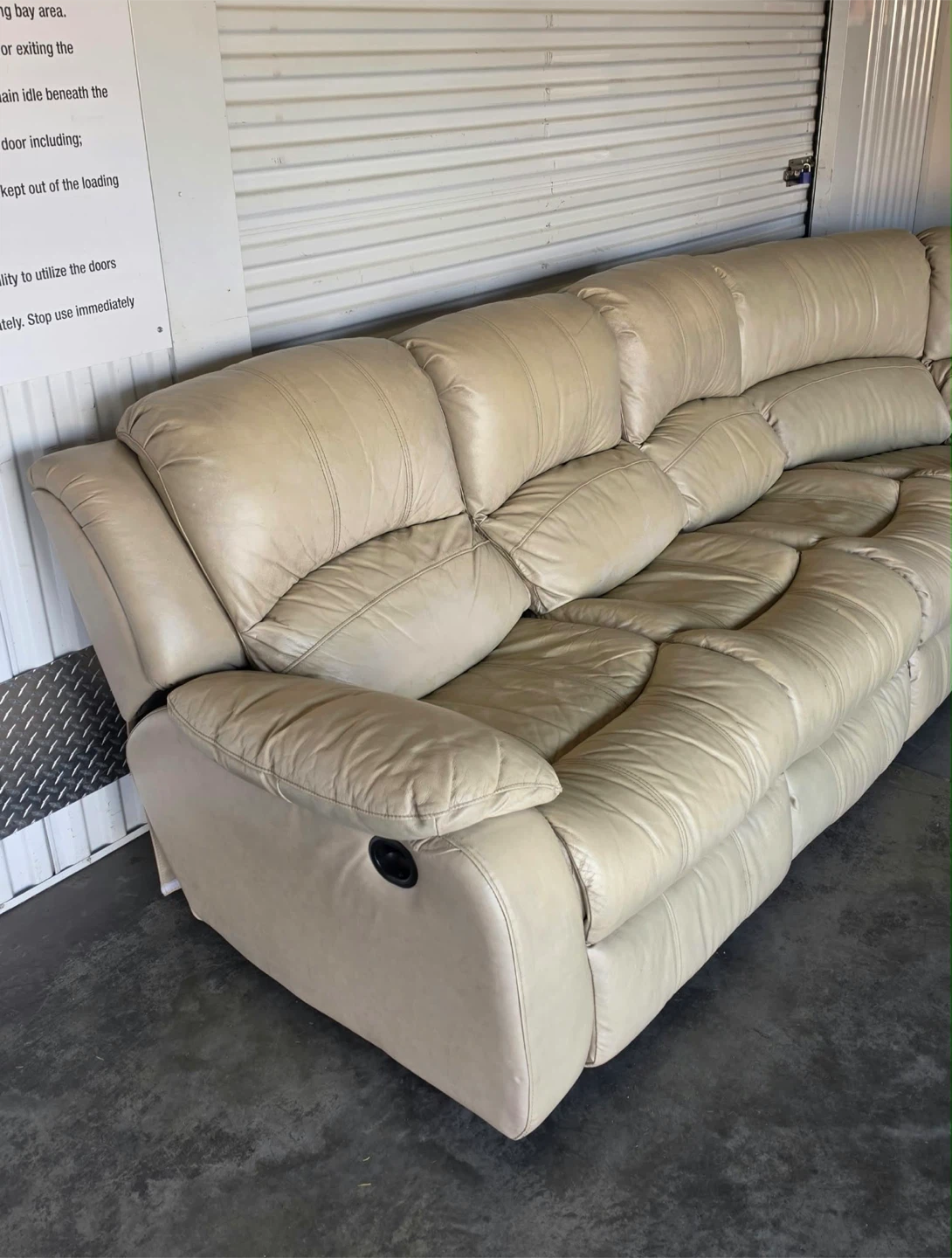 Spacious sectional sofa is upholstered in cream leather. - photo 3