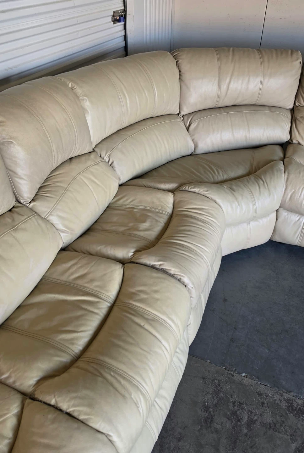 Spacious sectional sofa is upholstered in cream leather. - photo 5