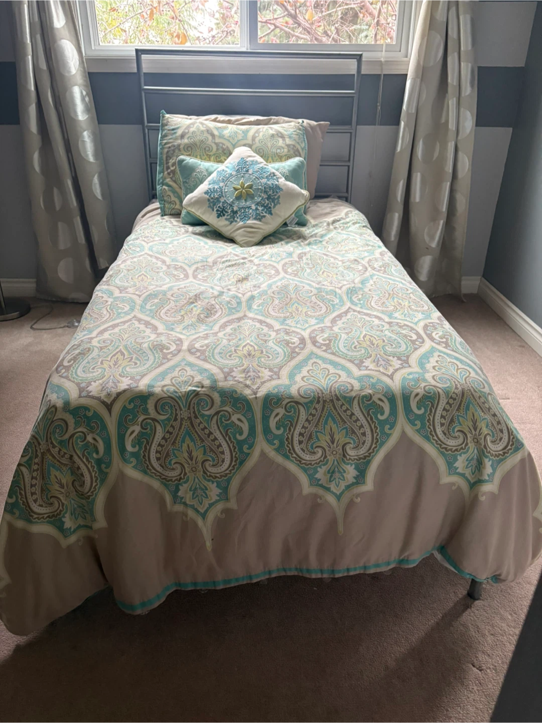 Twin size bed, with bedding and 2 extra sets of sheets