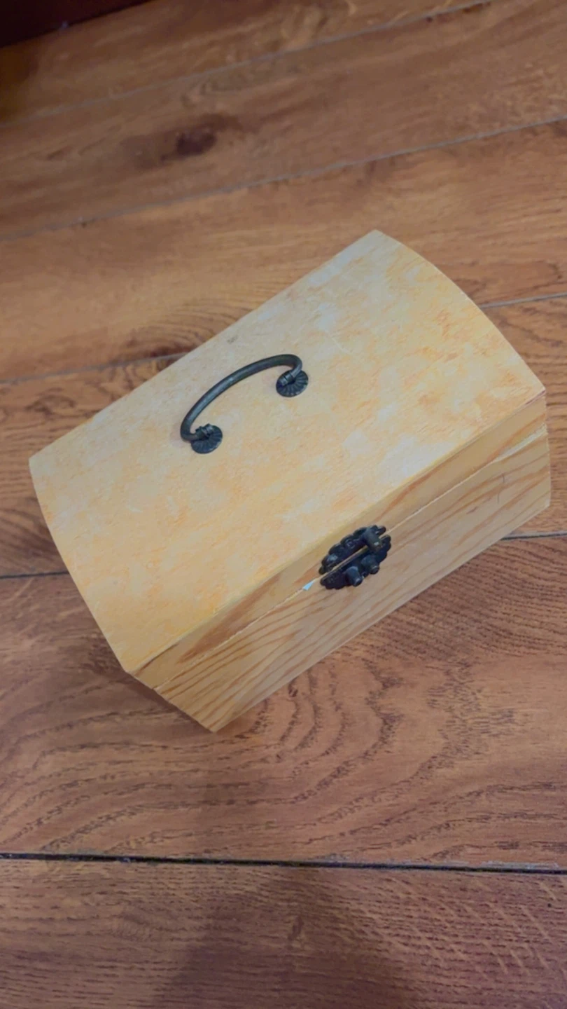 Wooden storage chest with handle