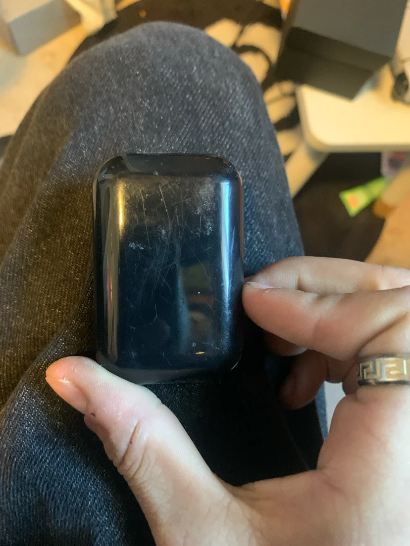 Black wireless earbuds with charging case