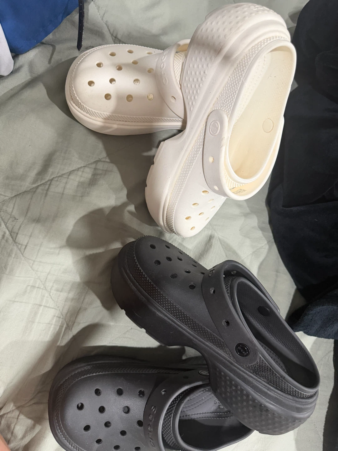 Two pairs of Crocs platform clogs