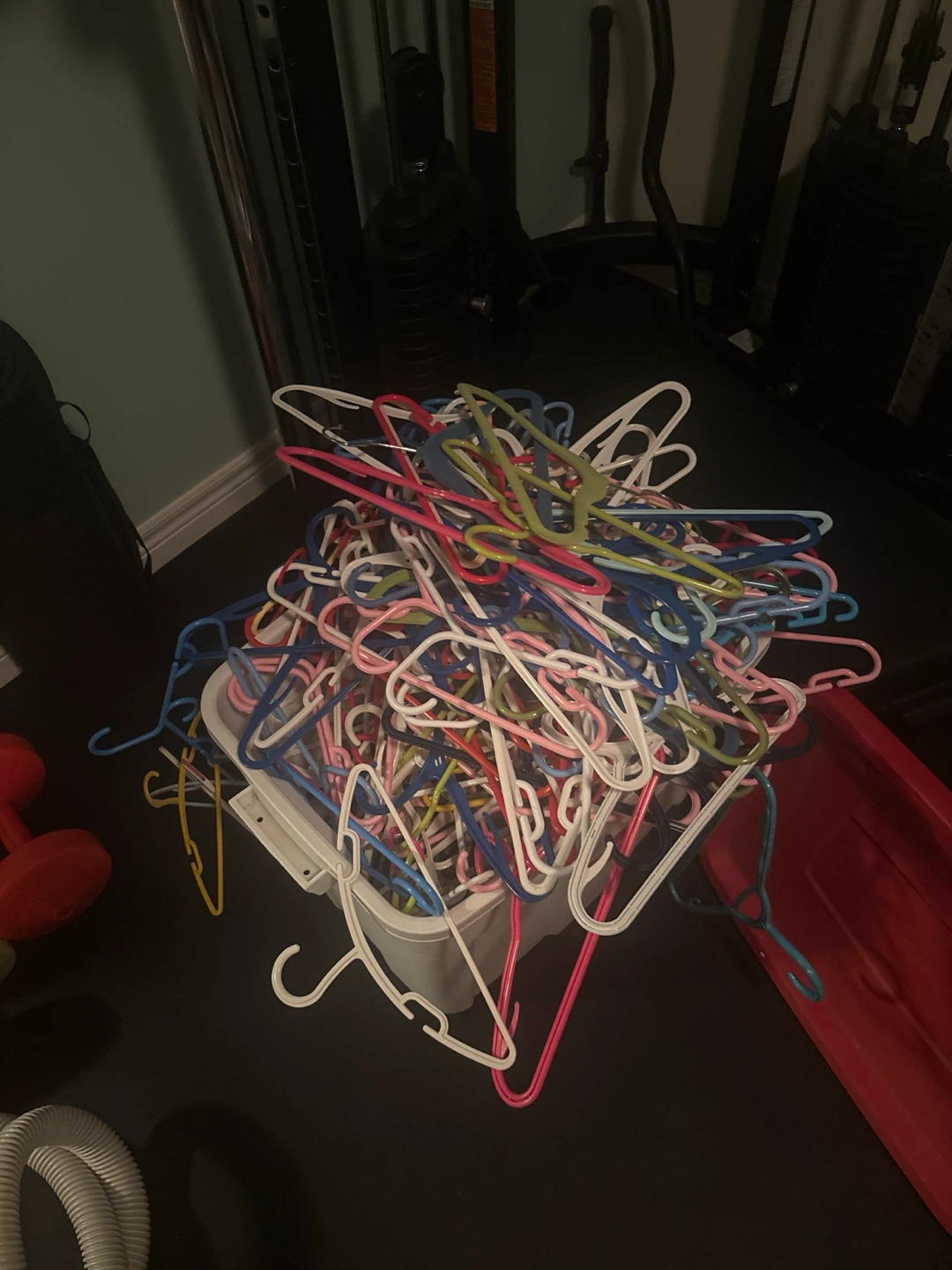 Assorted Plastic Clothes Hangers in Bin