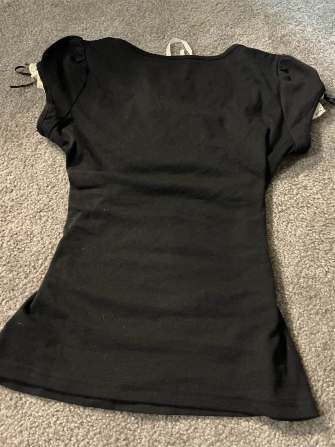 Black top with cream lace details