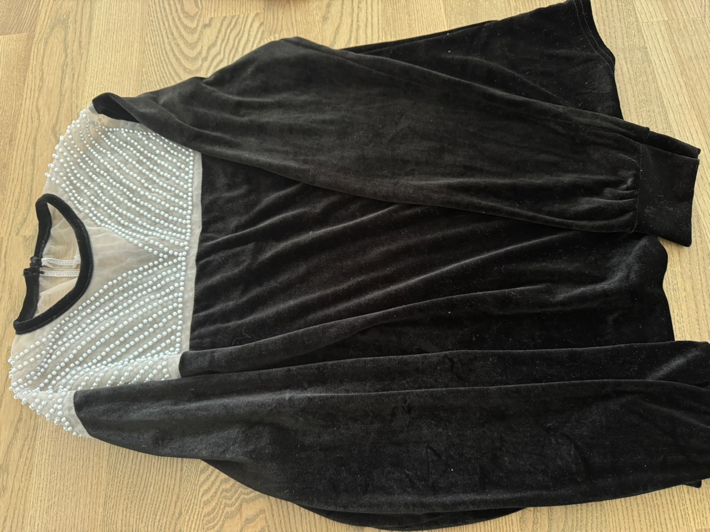 Designer’s Black velvet top with pearl detailing