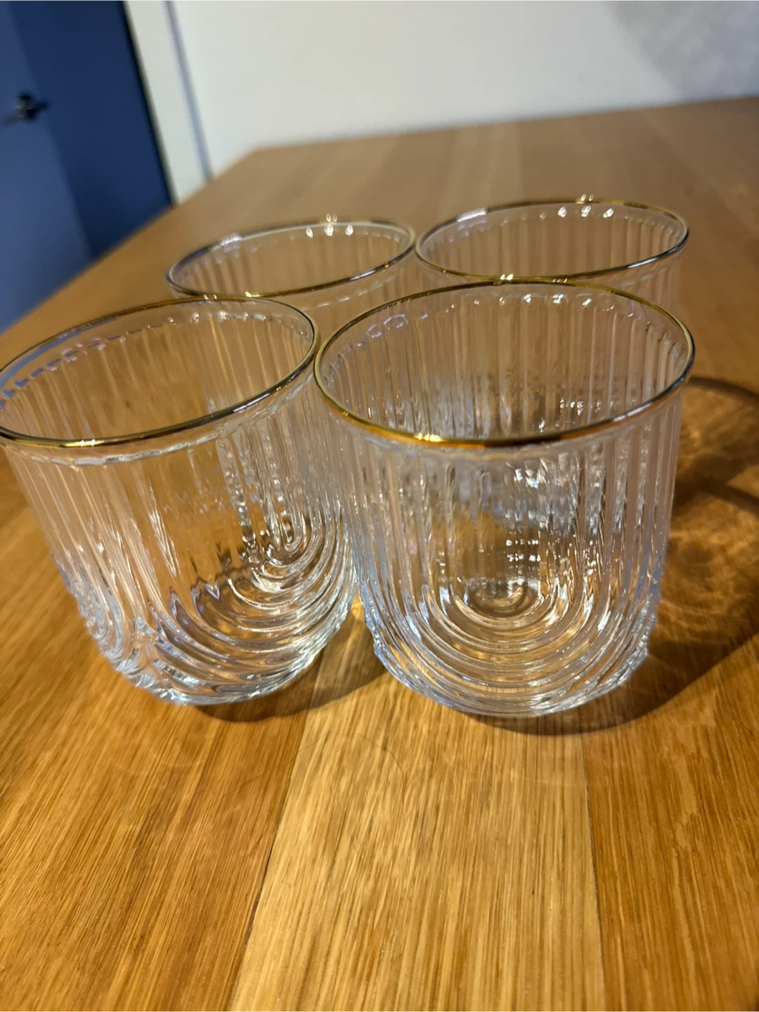 Set of 4 ribbed glass tumblers with gold rim