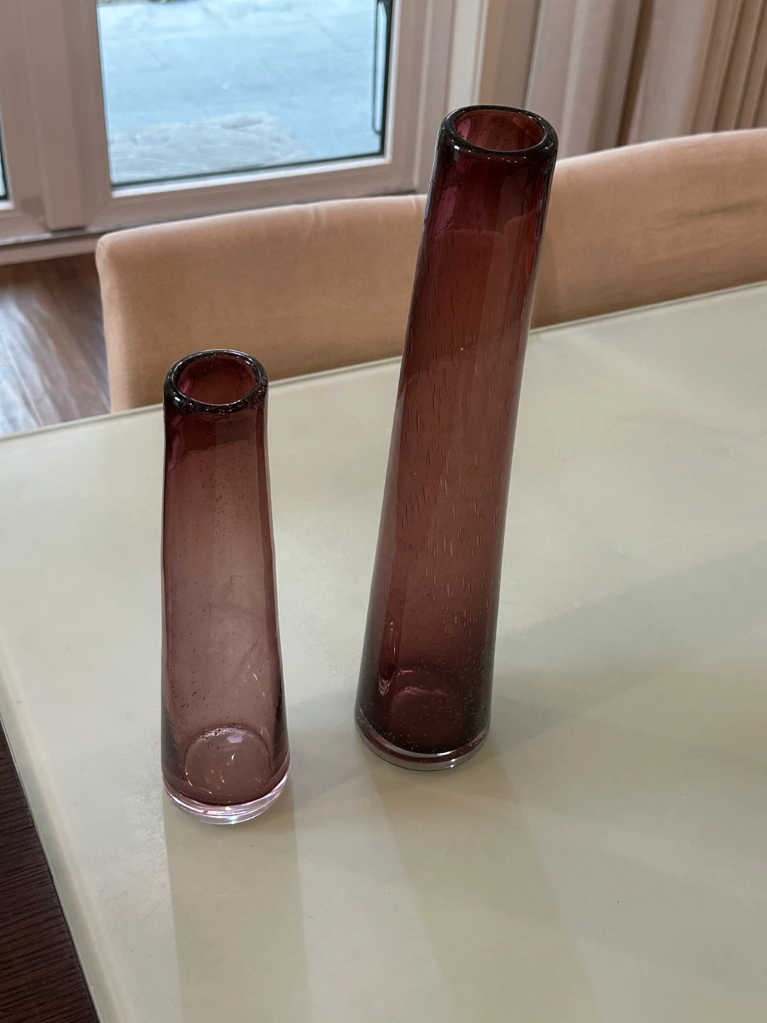 Set of two purple glass vases
