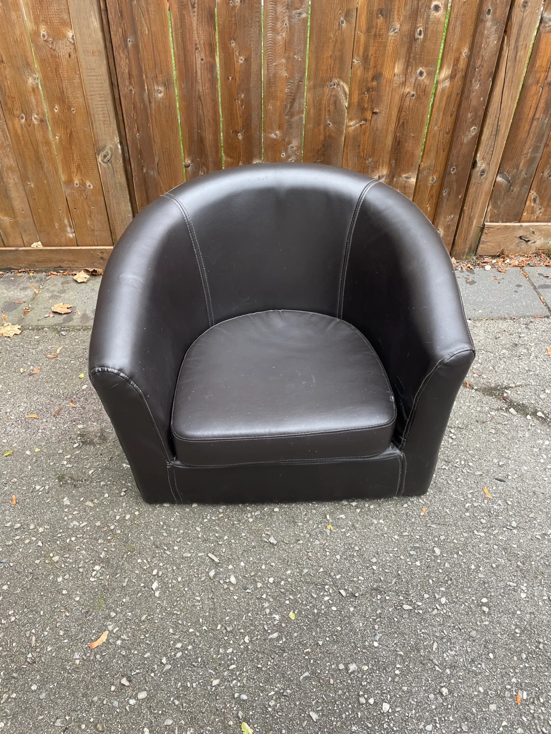 Dark brown leather-look barrel chair