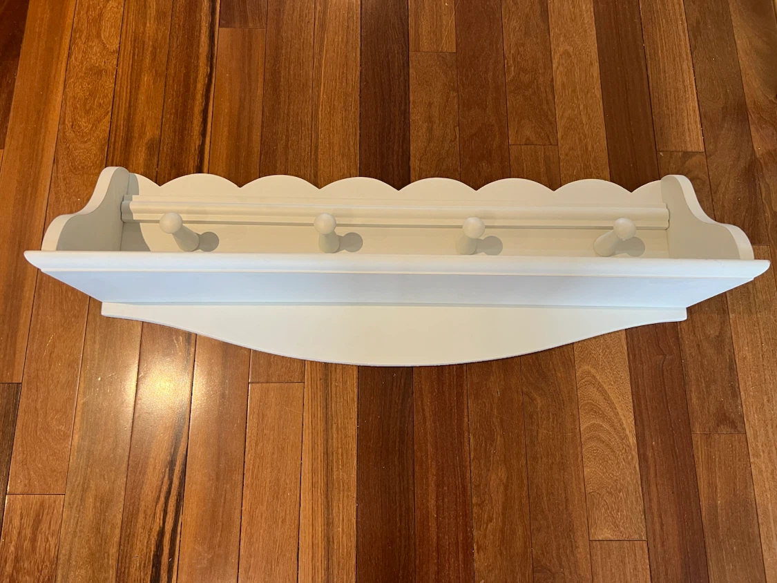 Pottery Barn- White Wall-Mounted Nursery Shelf with Hooks - photo 2