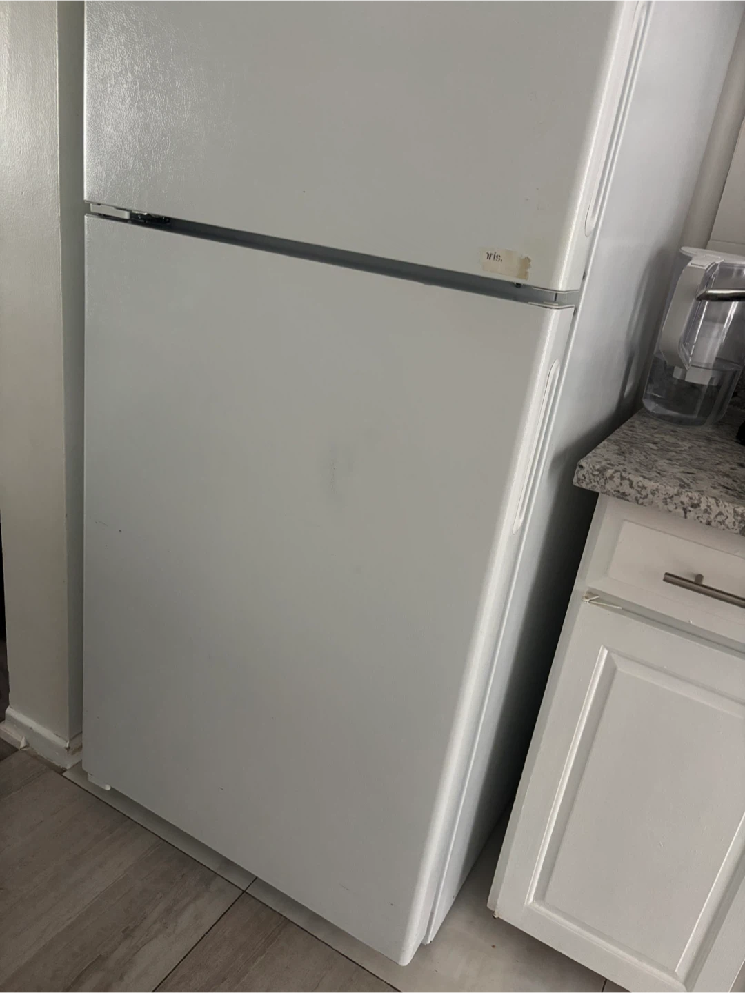 White top-freezer refrigerator