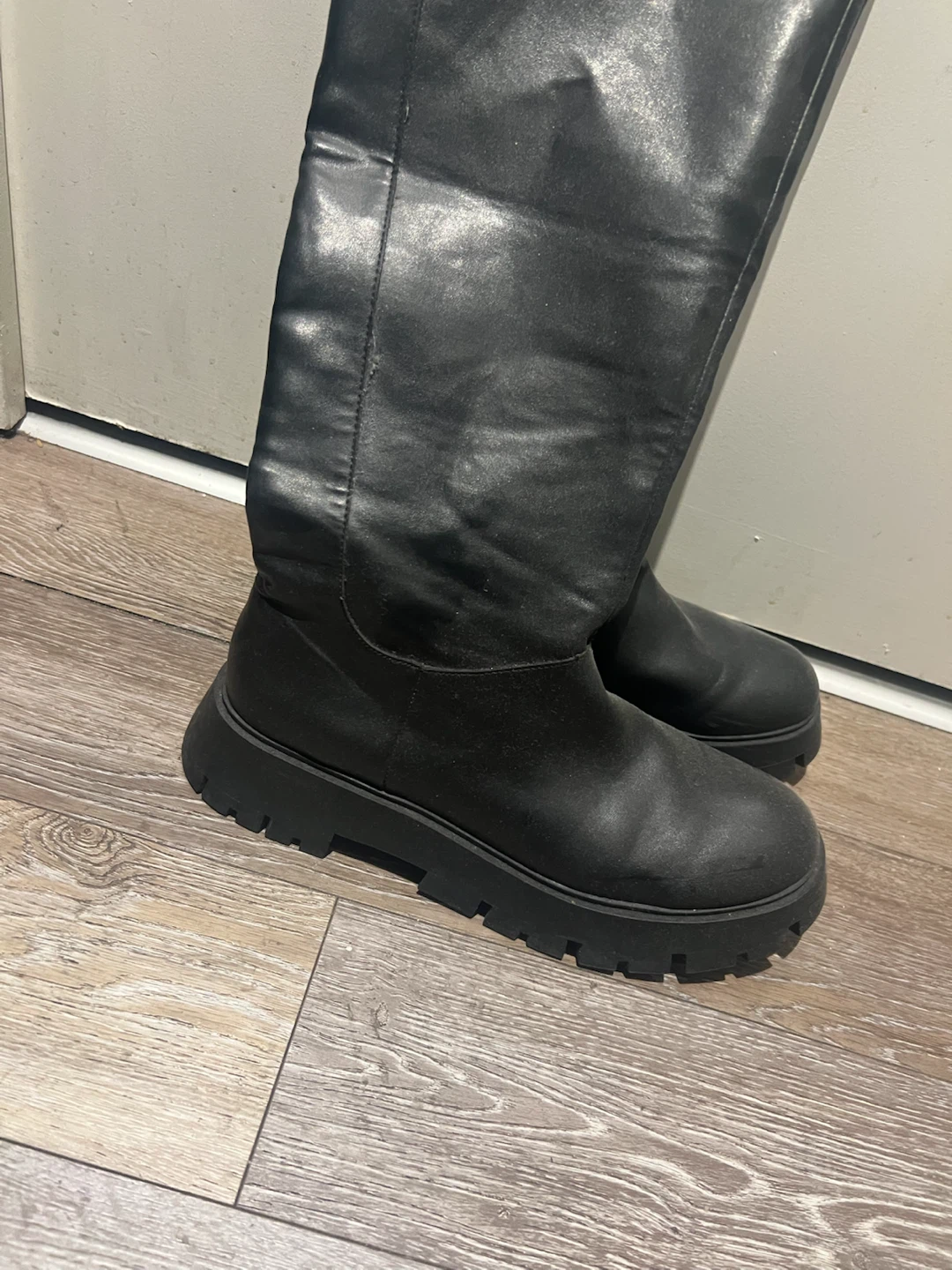 Black platform knee-high boots